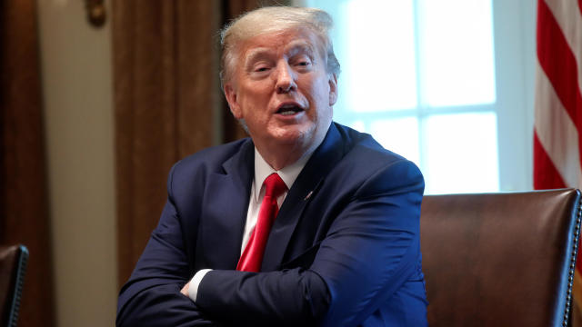 President Trump speaks during a meeting with recovered coronavirus patients and family members in the Cabinet Room at the White House in Washington, April 14, 2020. 