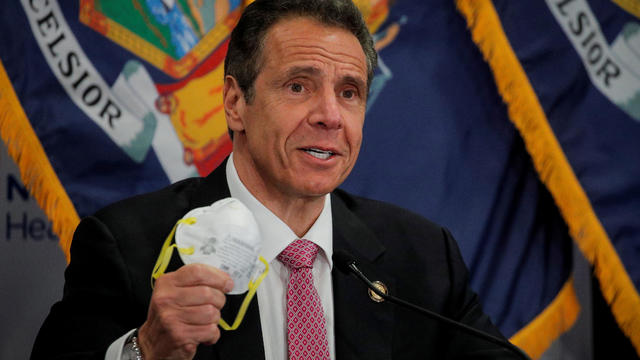 New York Governor Andrew Cuomo shows a face mask at a daily briefing at North Shore University Hospital, during the outbreak of the coronavirus disease (COVID-19) in Manhasset, New York 