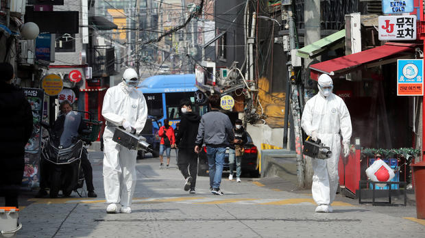Quarantine workers spray disinfectants at night spots of Itaewon neighborhood, following the coronavirus disease (COVID-19) outbreak, in Seoul 