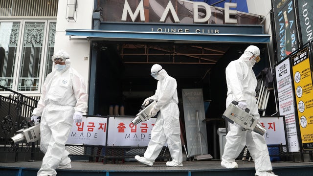 Quarantine worker spray disinfectants in front of a night club on the night spots in the Itaewon neighborhood, following the coronavirus disease (COVID-19) outbreak, in Seoul 
