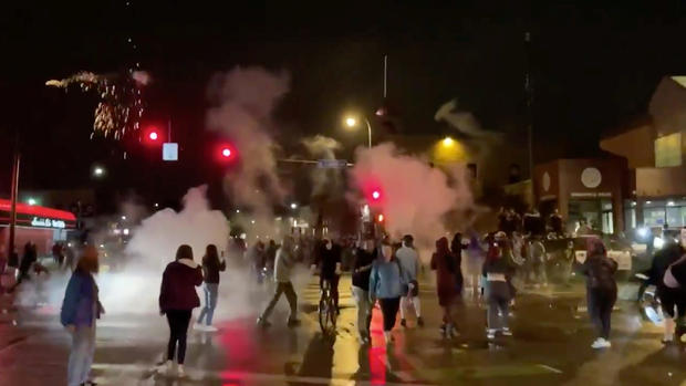 Still image shows police reportedly using tear gas and flash grenades against protesters demonstrating after the death of George Floyd in Minneapolis 