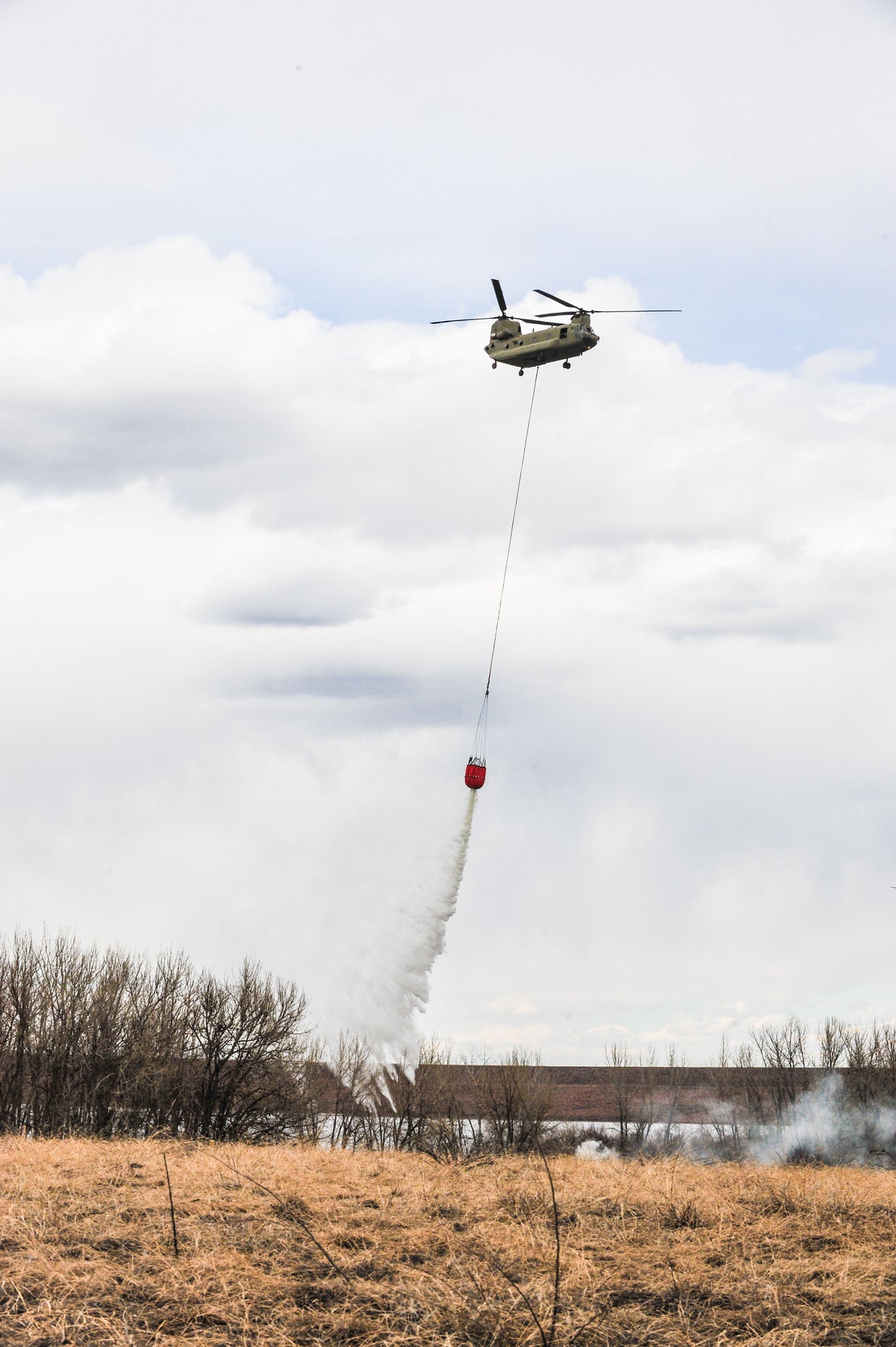 Black Hawk, Chinook Helicopters Conduct 'Water Bucket' Training At