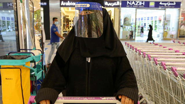 A Saudi woman, wearing a face shield, shops at a supermarket, following the outbreak of the coronavirus disease (COVID-19) in Riyadh 