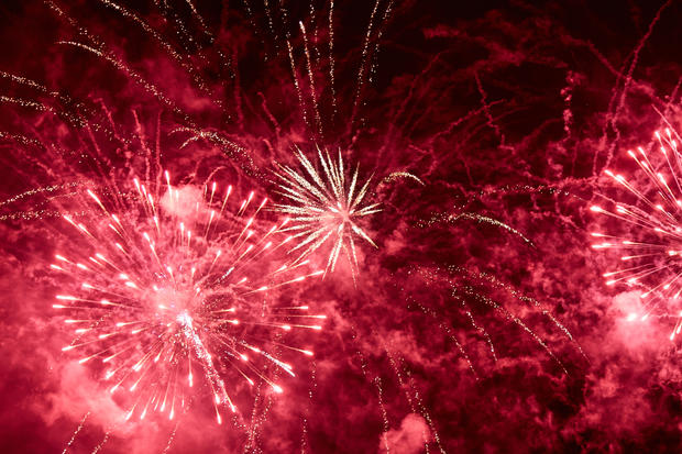 Explosions of red fireworks 