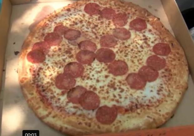 pizza-bought-on-june-27-2020-in-brook-park-ohio-little-ceasars-restaurant-with-pepperoni-placed-to-form-a-reverse.jpg 