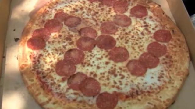 pizza-bought-on-june-27-2020-in-brook-park-ohio-little-ceasars-restaurant-with-pepperoni-placed-to-form-a-reverse.jpg 