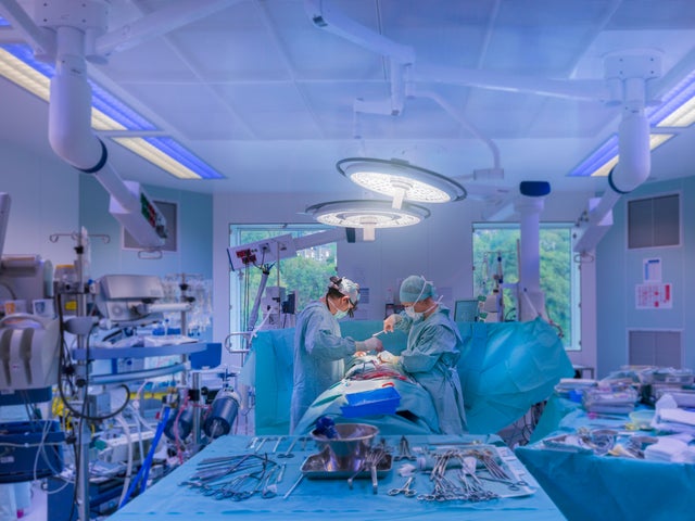 Surgeons performing open heart surgery 