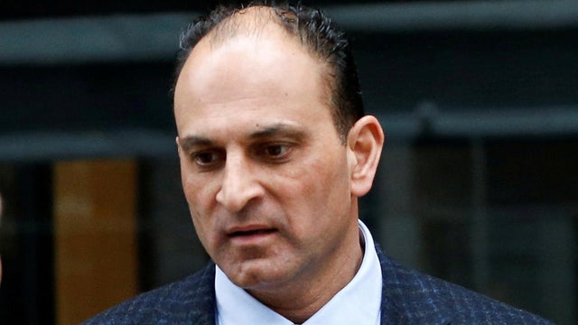 FILE PHOTO: David Sidoo, a Vancouver businessman and former Canadian Football League player, leaves the federal courthouse 