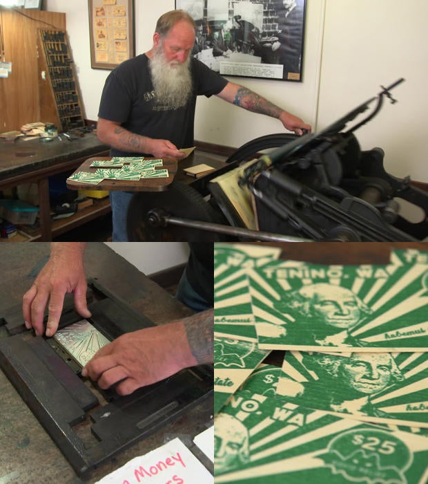 loren-ackerman-operates-printing-press-to-creater-wooden-currency.jpg
