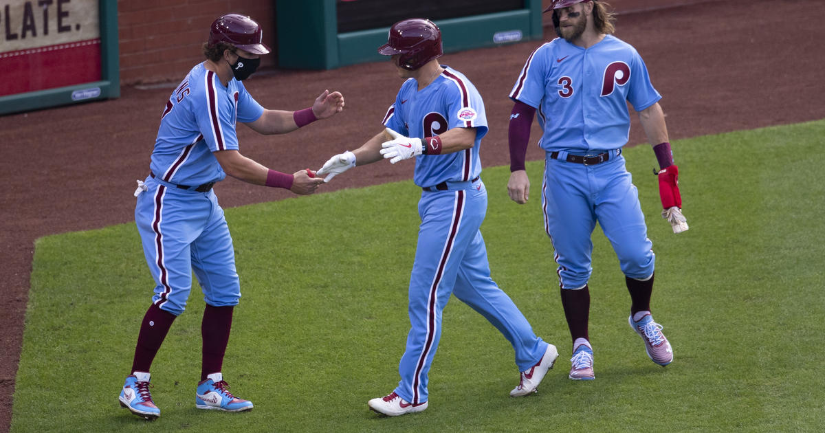 Manager Joe Girardi, Rhys Hoskins, J.T. Realmuto, Scott Kingery