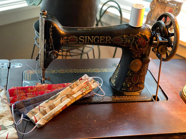 Couple restores 100-year-old sewing machine to make face masks 