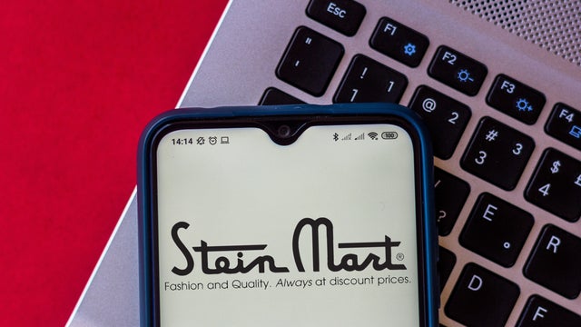 In this photo illustration, a Stein Mart logo seen displayed 