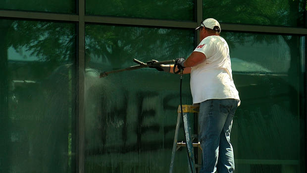 Worker Cleans Up 5th Precinct Vandalism 