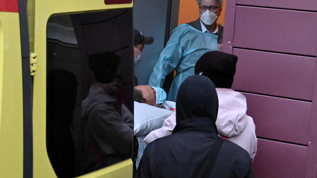 An ambulance transporting Russian opposition leader Alexei Navalny drives out of a hospital in Omsk 