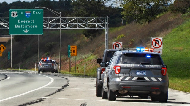 Pennsylvania State troopers pull over vehicles on September 4, 2020, along the Pennsylvania Turnpike in Breezewood, Pennsylvania. 