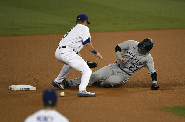 Colorado Rockies' Matt Kemp heads to home plate to score on a