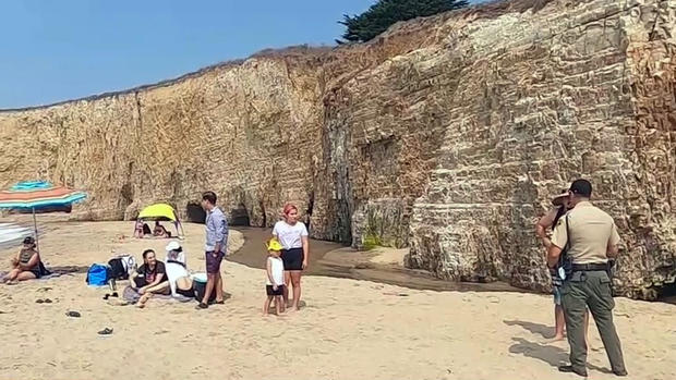 A Family is Reminded Not to Lounge on the Sand at a Santa Cruz County Beach Monday Sept. 7, 2020 