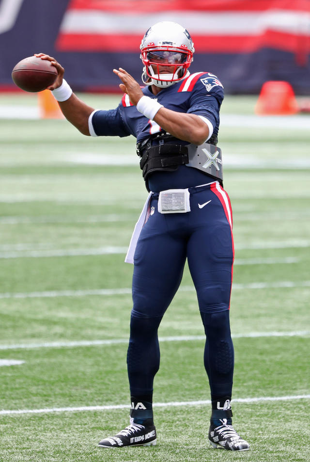 Cam Newton begins first Patriots game with a 'Bam' in golden pregame outfit