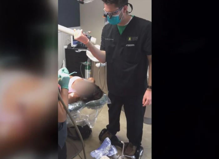 Dentist who extracted a patient's tooth while riding a hoverboard