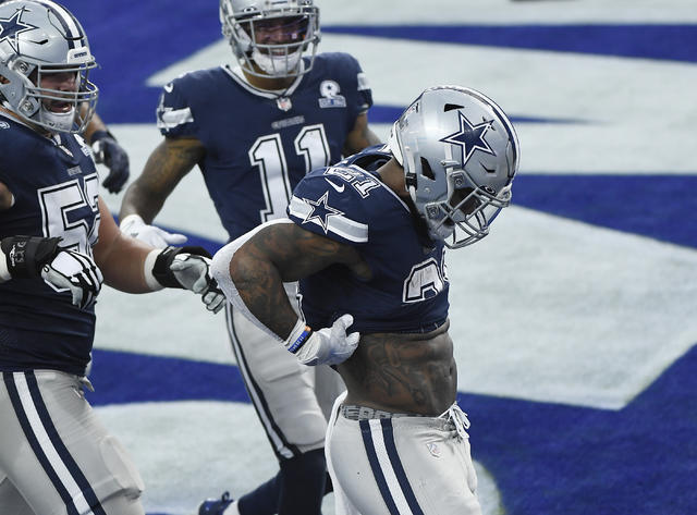 Dallas Cowboys running back Ezekiel Elliott signals first down