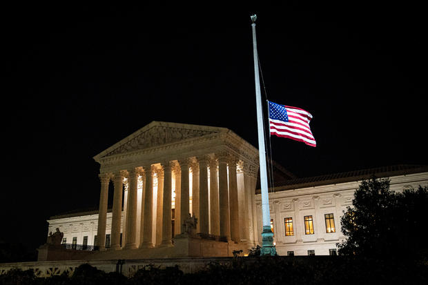 The American flag flies at half staff following the death of U.S. Supreme Court Justice Ruth Bader Ginsburg, outside of the U.S. Supreme Court, in Washington 
