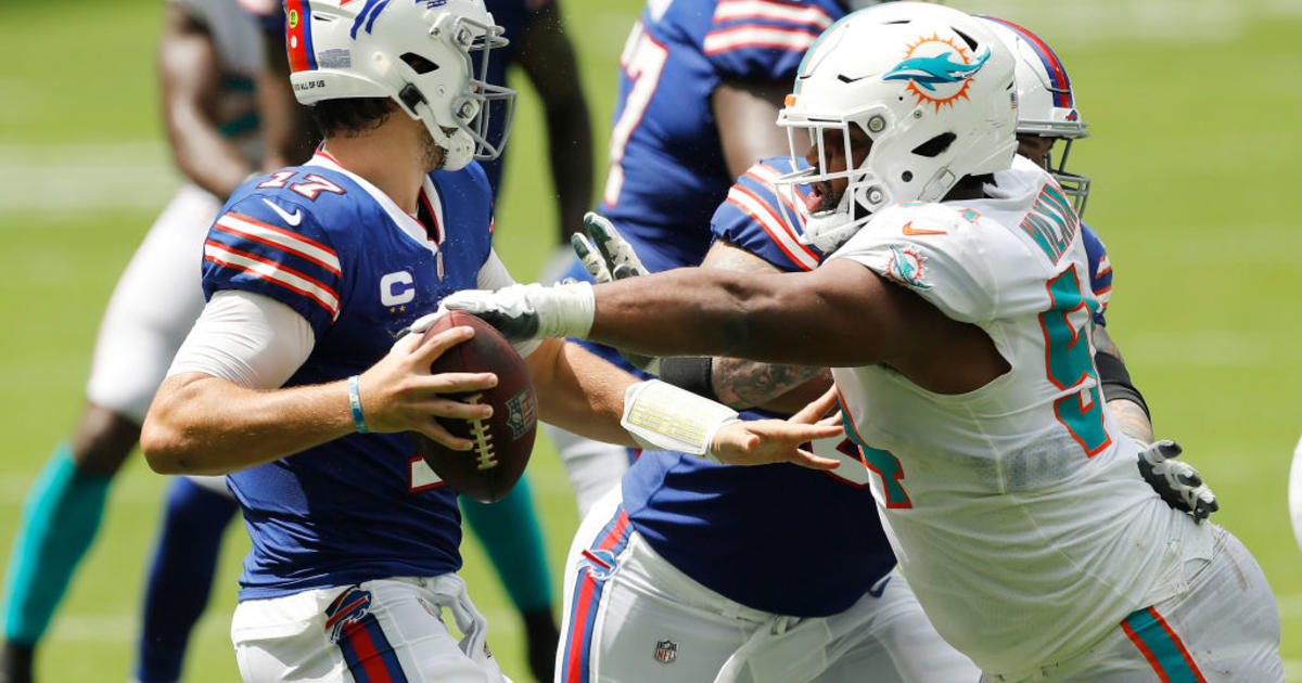 Miami Dolphins defensive tackle Davon Godchaux (56) reacts after