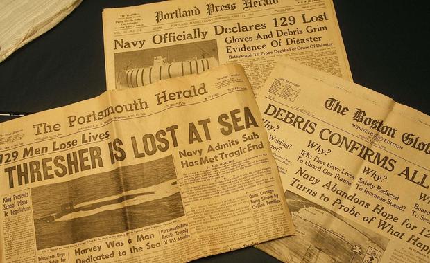 Yellowed newspapers from April of 1963 declare the tragedy of the USS Thresher. Photographed Tuesday 