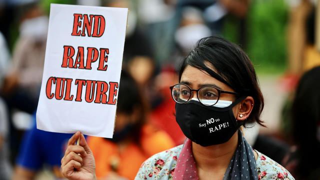 A feminist group take part in an ongoing protest demanding justice for the alleged gang rape of a woman 