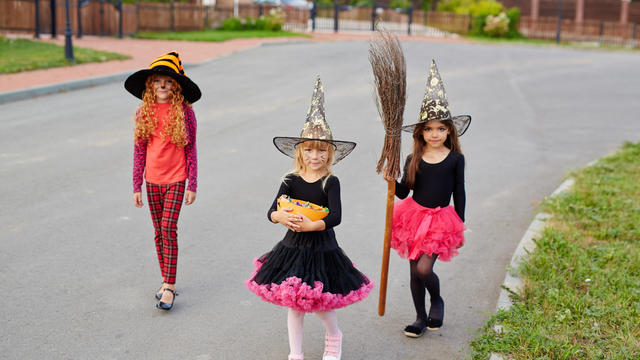 storyblocks-halloween-kids-walking-down-road-and-asking-for-a-treat_SnfvEexsW.jpg 