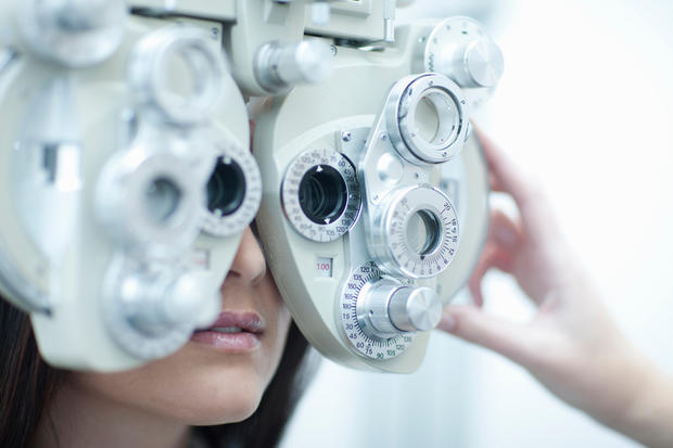 Young woman having eye test 