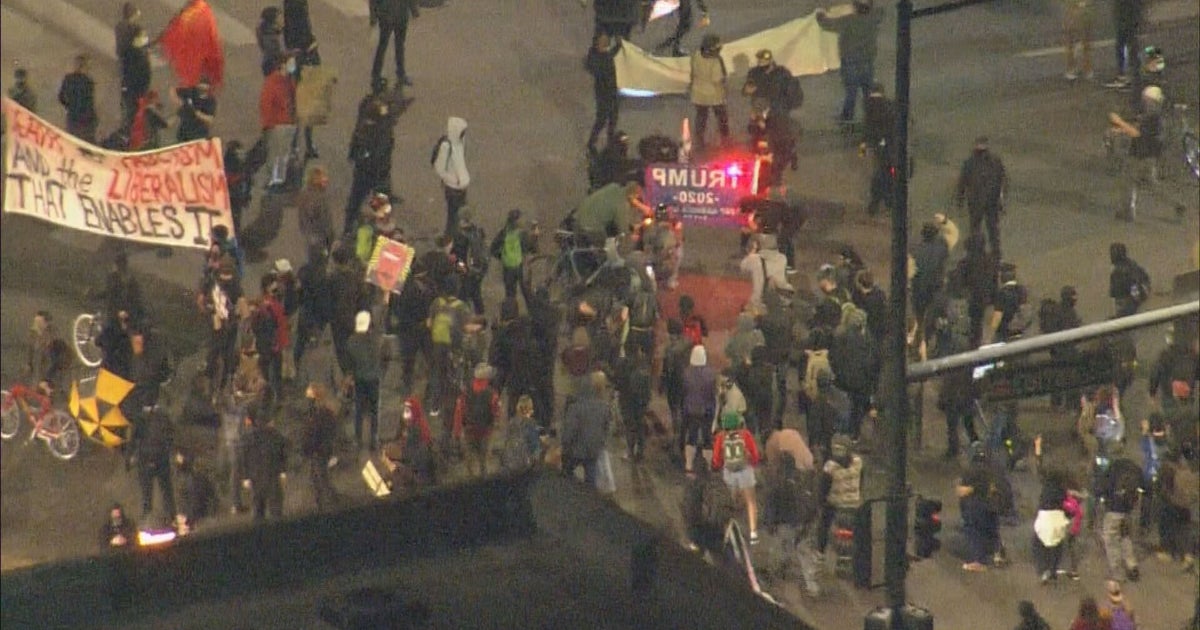Arrests Made After Protesters March Down Colfax Avenue, Burn Flags ...