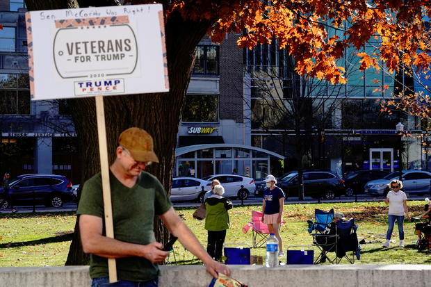 A supporter of U.S. President Donald Trump holds a Veterans for Trump placard in Madison 