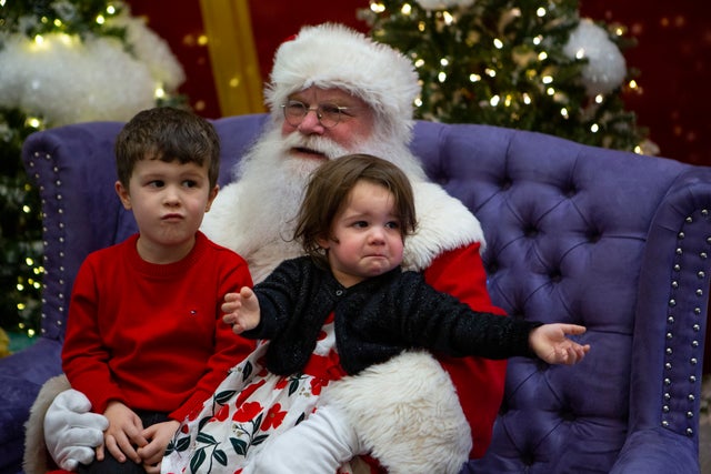 Some parents are questioning whether we should force crying children to sit on Santa's lap for photos, amid a national conversation about teaching children consent and children's boundaries. 