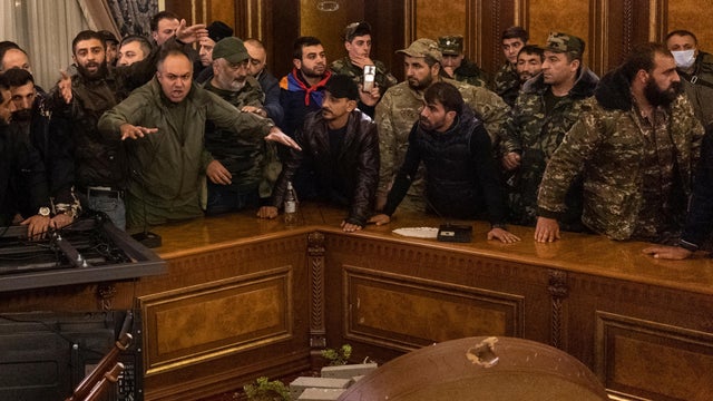 Protesters react inside the parliament in Yerevan 
