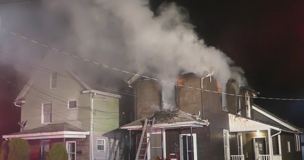 Firefighters Battle House Fire, Crews Help Elderly Woman To Safety