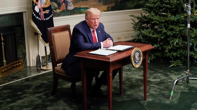 U.S. President Donald Trump speaks to reporters after participating in a Thanksgiving video teleconference with members of the military forces at the White House in Washington 