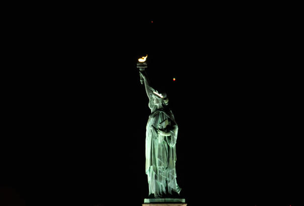 Crescent Moon Sets Behind the Statue of Liberty in New York City 