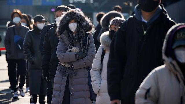 People wait in a line to undergo coronavirus disease (COVID-19) test at a coronavirus testing site in Seoul 