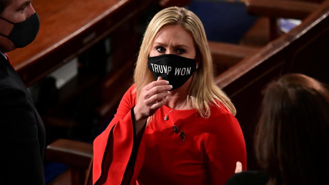 U.S. Rep. Marjorie Taylor Greene (R-GA) wears a "Trump Won" face mask as she arrives to take her oath of office as a member of the 117th Congress in Washington 