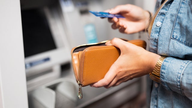 Woman withdrawing money from ATM 