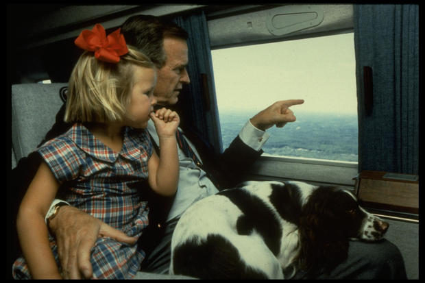 US Pres. George Bush, holding granddaughter Marshall Lloyd 