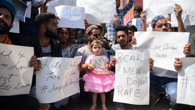 Protesters seen holding placards during the demonstration in 