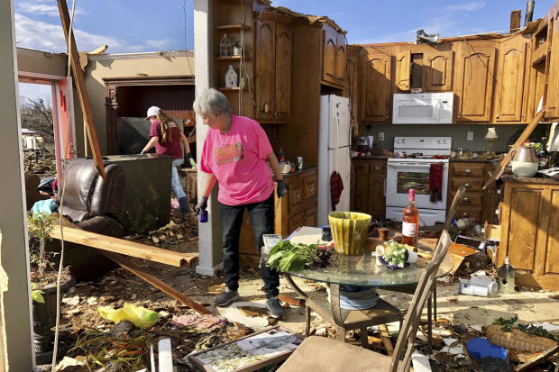 Patti Herring sobs as she sorts through the remains of her home in Fultondale, Alabama, on January 26, 2021, after it was destroyed by a tornado. 