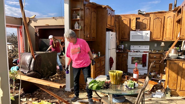 Patti Herring sobs as she sorts through the remains of her home in Fultondale, Alabama, on January 26, 2021, after it was destroyed by a tornado. 