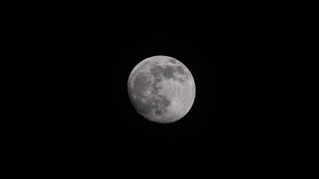 Waxing Moon In Cloudy Sky 