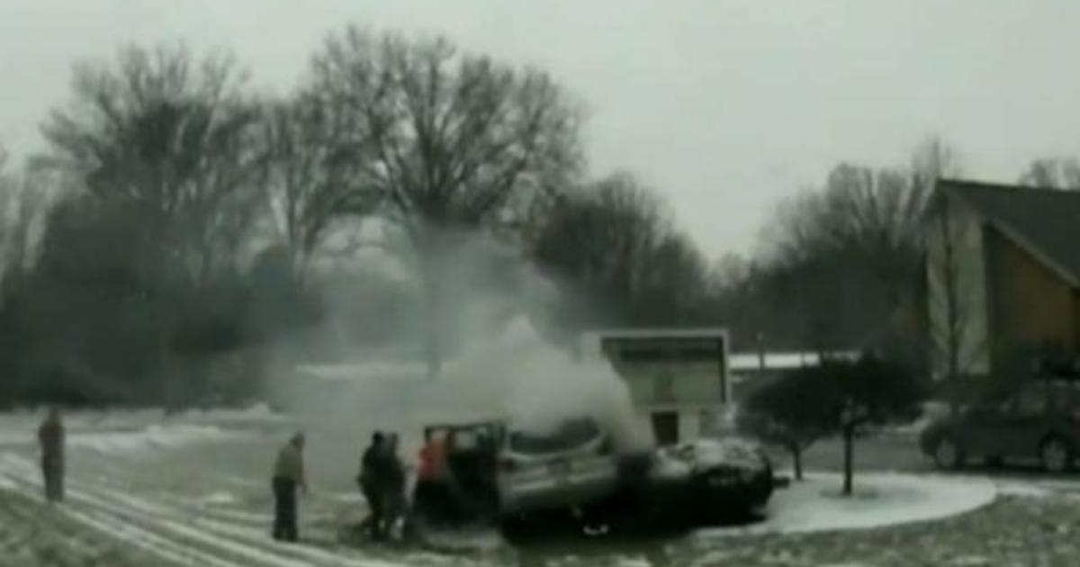 Officer, Bystanders Rescue Man Trapped In Burning Car - CBS News