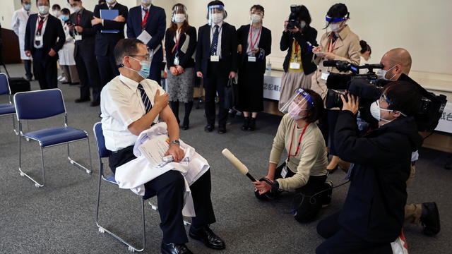 Director of the Tokyo Medical Center Kazuhiro Araki speaks to the media after receiving a dose of the coronavirus disease (COVID-19) vaccine as Japan launches its inoculation campaign, in Tokyo 