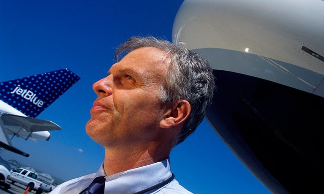 JetBlue CEO David Neeleman near Airplanes 