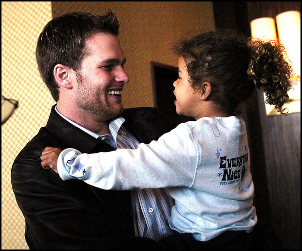 (2/2/04Houston, TX) Super Bowl XXXVIII. New England Patriots. Morning after MVP press conference.  Tom Brady iholds his neice Maya after being awarded the MVP trophy at the  MVP press conf. (020204mvpmjs-staff photo by Michael Seamans. Saved in photo 