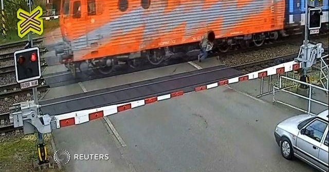 Watch: Man walks away after being hit by train - CBS News